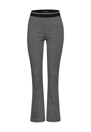 Pantalons évasés à motif noir et blanc avec une large ceinture élastique, présentant un design en zigzag et une finition lisse et texturée.
