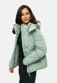 Mint green puffer jacket with a detachable hood, zip and snap closures, and side pockets. Features a quilted design and logo detail.