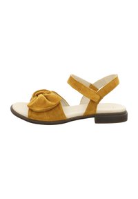 Yellow suede sandal with a knot detail at the front, open toe, and crossover ankle straps. Flat sole with a slight heel.