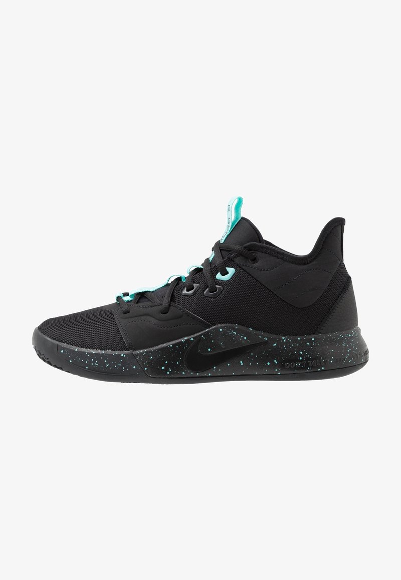 Baskets de sport basses noires et turquoise avec tige en mesh, logo Nike noir, semelle intermédiaire mouchetée, et passants de lacets ainsi que languette turquoise.