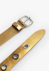 Gold leather belt with a square silver buckle, featuring two grommets and a decorative skull accent on the keeper. Smooth texture.