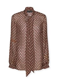 Blusa trasparente con colletto a fiocco, caratterizzata da una base marrone chiaro e motivi ovali marrone scuro, polsini elasticizzati e una vestibilità ampia.