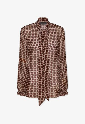 Durchsichtige Bluse mit einem Schleifenkragen, in einem hellbraunen Grundton mit dunkelbraunen ovalen Mustern, elastischen Bündchen und lockerer Passform.