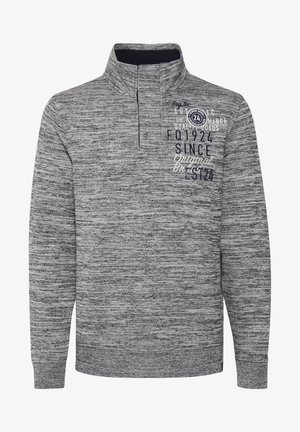 Szürke textúrájú pulóver félig cipzárral, sötétkék és fehér nyomott mintákkal díszítve. Az anyag melírozott mintázatú.