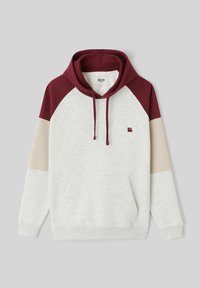 Sweat-shirt à capuche avec un dessus bordeaux, des panneaux beige et gris clair, une poche avant et un logo sur la poitrine. Fabriqué en tissu doux.