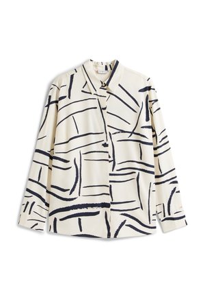 Cămașă cu mâneci lungi, de culoare crem, cu un model abstract de linii negre, prevăzută cu guler și nasturi pe partea din față, realizată dintr-un material neted.