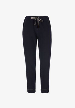 Tmavomodré neformálne nohavice s elastickým pásom, bielym sťahovacím šnúrkou, bočnými vreckami a manžetami na členkoch s viditeľným prešitím.