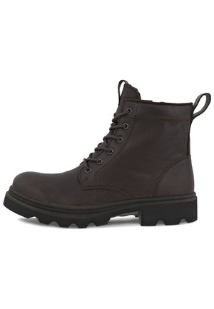 Brown leather ankle boot with six eyelets, round toe, rugged sole, and pull tab. Features ankle height and reinforced stitching for durability.