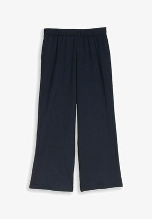Pantalon large bleu marine avec taille élastique, tissu texturé et coupe longueur cheville.