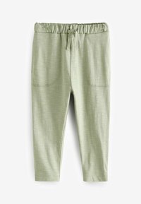 Pantalons vert clair avec taille élastique et cordon de serrage, deux poches avant, et un tissu lisse et texturé. Conçus pour le confort et la facilité de mouvement.