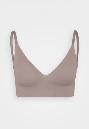 Mauve bralette met een diepe V-halslijn, gemaakt van gladde, rekbare stof. Heeft dunne verstelbare bandjes en geen zichtbare hardware of padding.