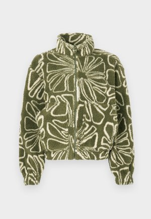 Giacca in pile verde con motivo floreale bianco, dotata di collo alto, zip frontale e polsini elastici. Comprende due tasche frontali.