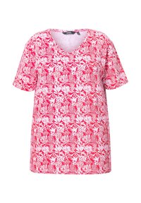 Krátký rukáv, top s V-výstřihem ve světle růžové barvě s bílým květinovým vzorem. Látka má hladkou texturu a volný střih pro pohodlí.