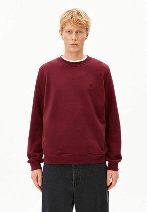 Bordeauxrotes Sweatshirt aus weicher Baumwolle mit langen Ärmeln und geripptem Rundhalsausschnitt; verfügt über ein kleines, besticktes Logo auf der Brust.