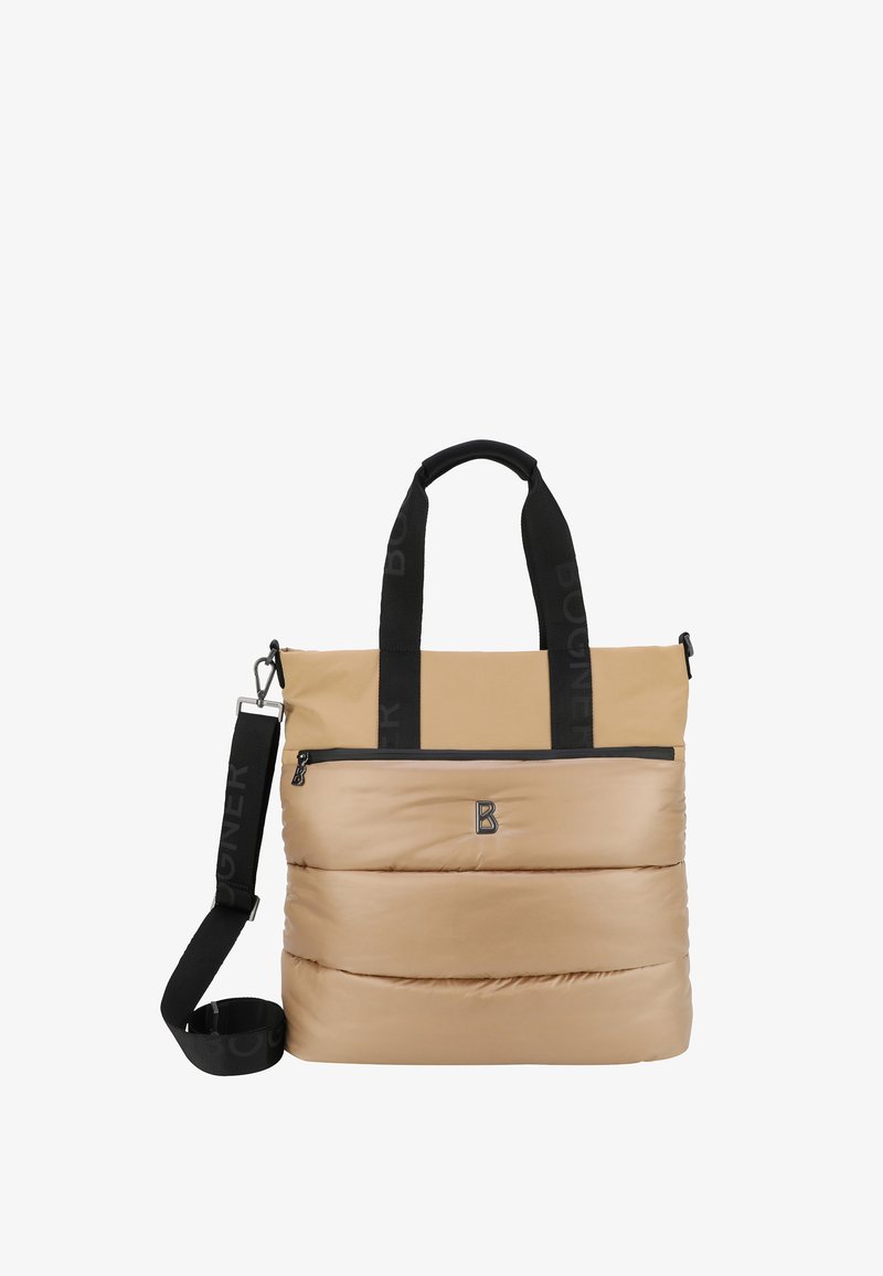 Borsa tote imbottita beige con cinturini neri con logo, tasca anteriore con zip e tracolla removibile. Texture liscia e design moderno.