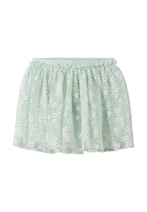 Gonna di tulle azzurro chiaro con vita elastica, decorata con motivi floreali di margherite bianche e gialle.