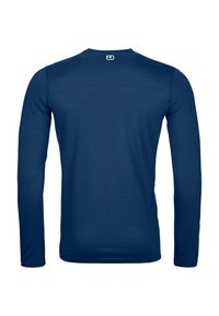 Long-sleeve shirt in navy blue, made of soft fabric. Features a round neck and a simple design with no additional patterns or accents.