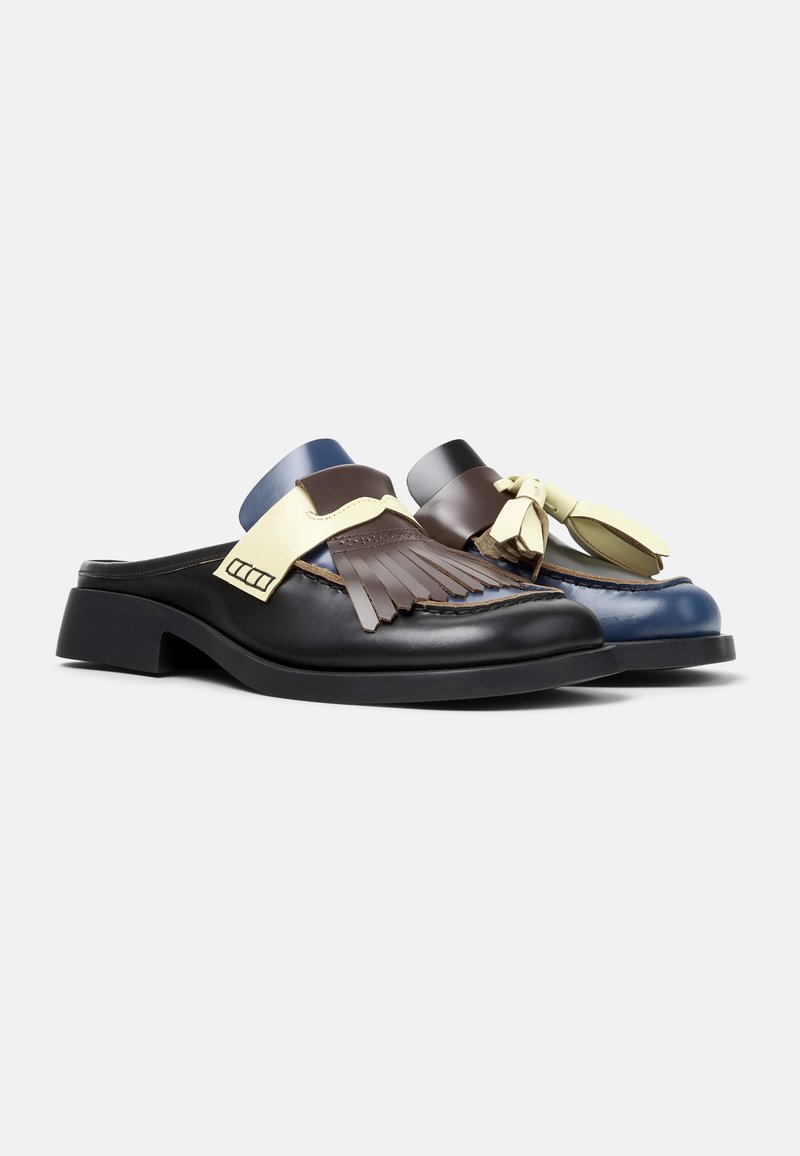 Leather mules in black and blue with decorative fringes and accents. Features a flat sole and contrasting straps in yellow and blue.