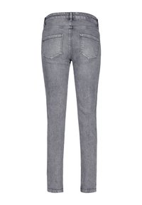 Grå denim skinny jeans med en midjehöjd, två bakfickor och en slät yta. Ren finish med minimala metall detaljer.