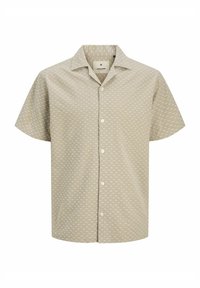 Camicetta a maniche corte in tessuto beige chiaro con un motivo geometrico bianco, dotata di colletto e chiusura frontale a bottoni.