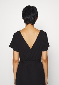 Object Trikoomekko - black