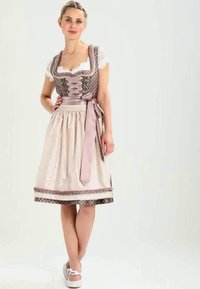 Dirndl dress featuring a fitted bodice with lace trim, brown patterned fabric, and a light-colored gathered skirt with ribbon tie and decorative accents.