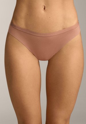 Nude hipster panties made of smooth material with a flat waistband, featuring subtle logo detail. Designed for comfort with minimal coverage.