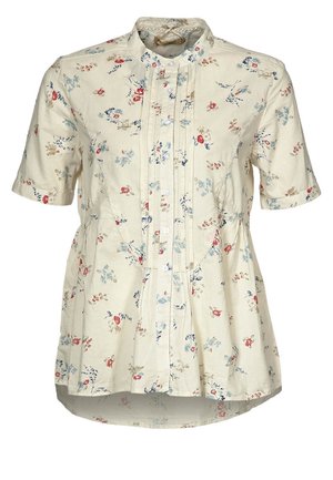 Chemisier crème à manches courtes avec petit imprimé floral rouge, bleu et beige, devant boutonné et légère évasement à la taille.