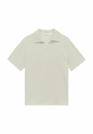 Light beige polo shirt with a textured fabric, short sleeves, and a notched collar. Label visible at the neckline.
