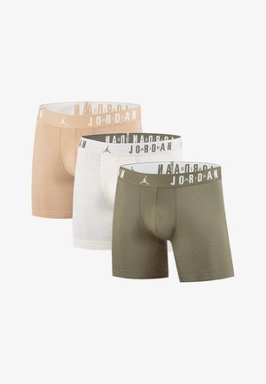 Three pairs of men's boxer briefs in beige, white, and olive green. Each has a contrasting logo band with "JORDAN" printed in white.