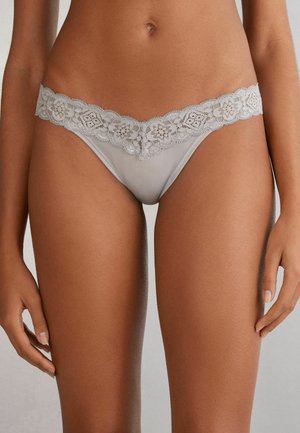 Gray lace thong with floral pattern on waistband, soft fabric, v-shape design, and delicate edging. Smooth texture with minimal coverage.