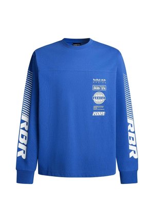 Blaues Langarmshirt aus Baumwolle mit Rundhalsausschnitt, strukturiertem Stoff und weißen Druckgrafiken auf der Vorderseite und dem Ärmel.