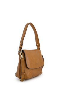 Tan leather shoulder bag with an adjustable strap, flap closure, gold hardware, and a smooth texture. Features subtle logo on the front.