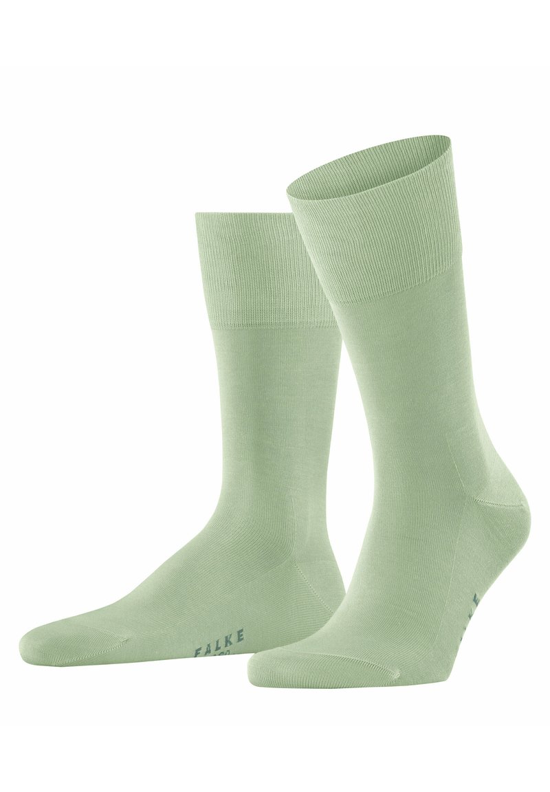 Calzini di cotone verde chiaro con polsini a costine, una trama liscia e un piccolo logo stampato in una tonalità più scura vicino alla punta.