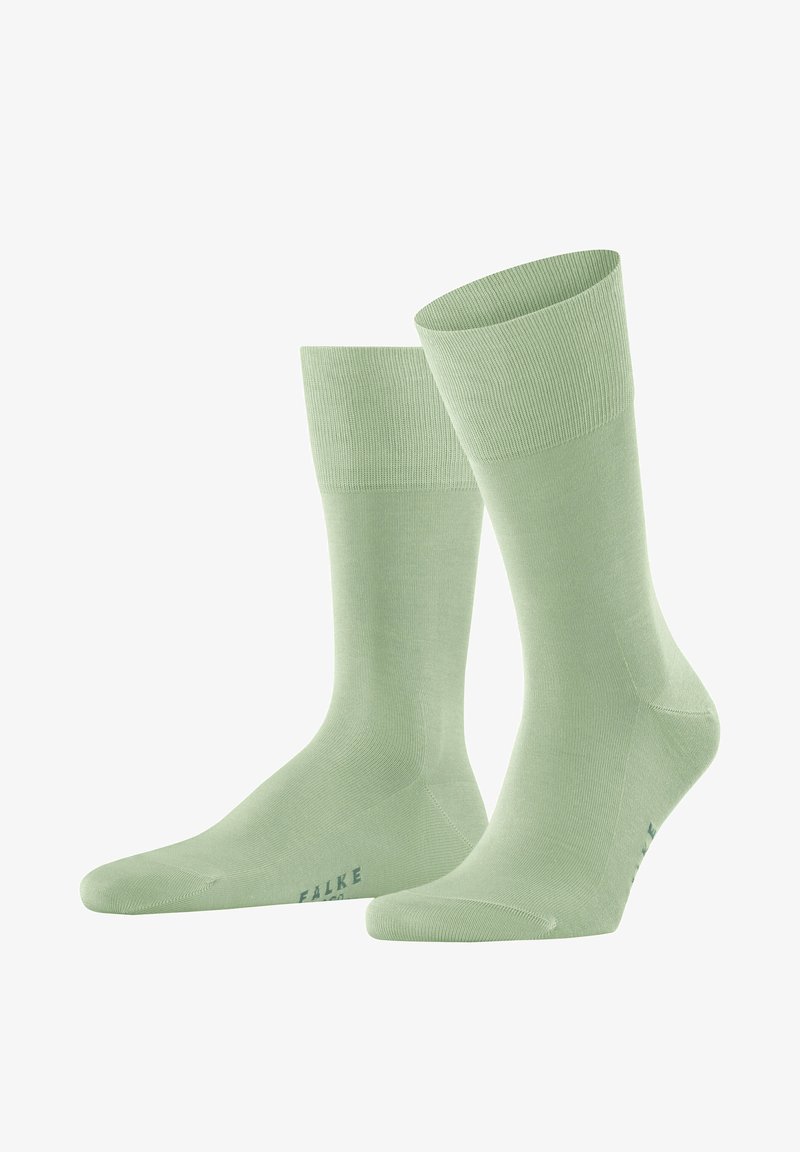 Hellgrüne Baumwollsocken mit gerippten Bündchen, einer glatten Textur und einem kleinen Logo, das in einem dunkleren Farbton nahe der Zehe gedruckt ist.