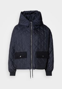 Marine-blau gesteppte Jacke mit dicker Kapuze, Frontreißverschluss und zwei großen schwarzen Cord-Taschen. Mit elastischen Bündchen und Kordelzug am Saum.