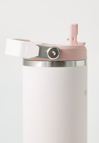 Stainless steel water bottle with a matte white finish, pink lid, and a metal accent. Features a flip-top straw for easy drinking.