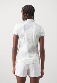 J.LINDEBERG Sports CARA  - Polo majica - ambrosia