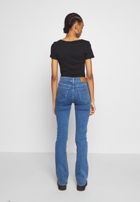 Levi's® 725™ HIGH RISE BOOTCUT - Calças de ganga bootcut - blue denim