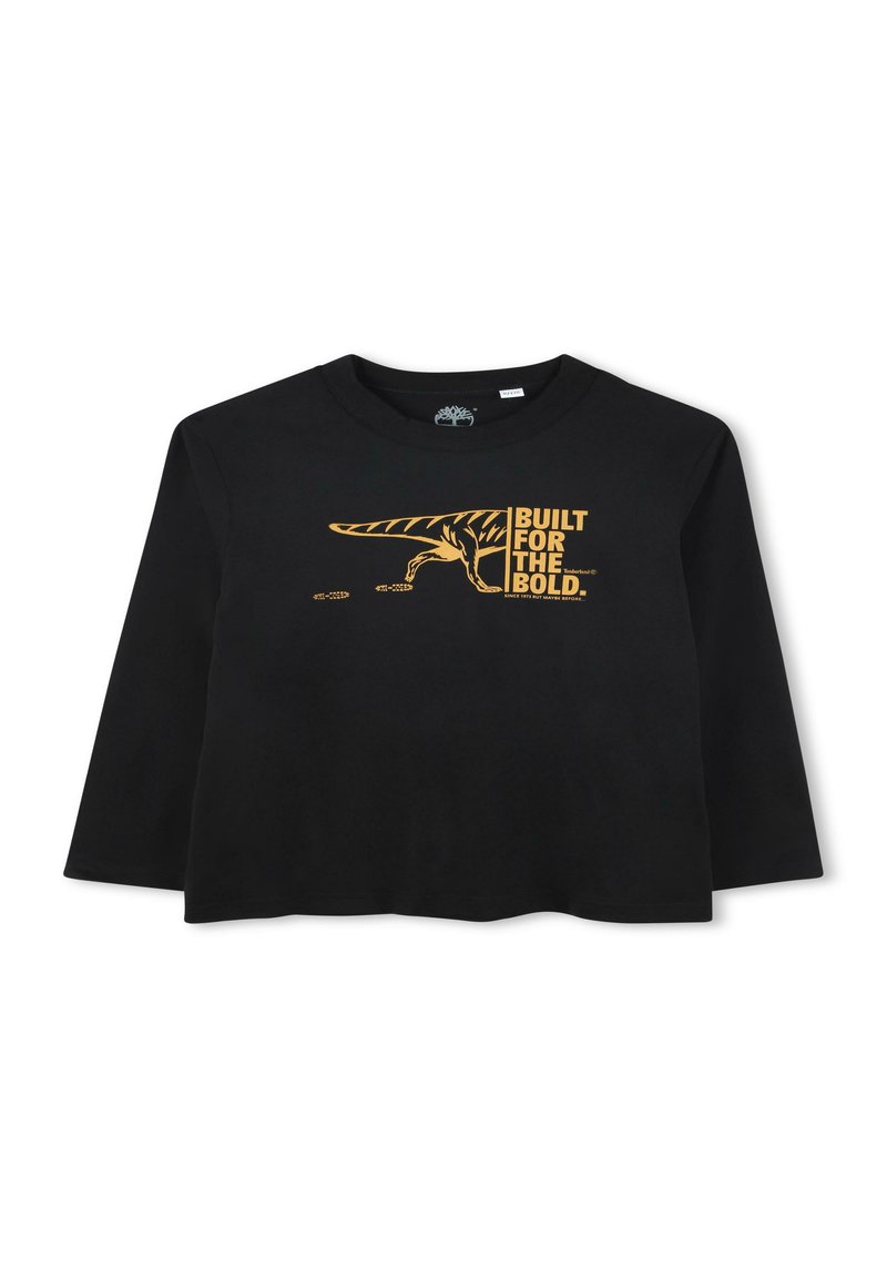 Zwarte lange mouwen T-shirt met een cropped ontwerp. Kenmerkt een gouden dinosaurusgrafiek en de tekst "BUILT FOR THE BOLD" die prominent wordt weergegeven.