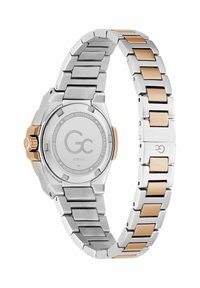 Zegarek ze stali nierdzewnej z bransoletą w kolorze srebrnym i różowego złota, okrągłą kopertą oraz szczegółowym tyłem z logo marki i szwajcarskim mechanizmem.