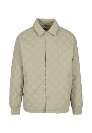 Geplüschte, hellgrüne Jacke mit knopflosem Vorderteil, Kragen und gerippten Bündchen. Der Stoff hat eine glatte Textur mit einem Rautenmuster.