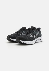 Black athletic shoes with a textured upper, white sole, and reflective accents. Features a lightweight design and contrasting patterns.