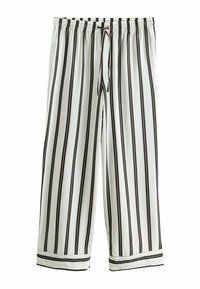 Białe luźne spodnie z czarnymi pionowymi paskami, elastycznym pasem, regulowanym sznurkiem oraz czarnymi prążkowymi mankietami przy kostkach.