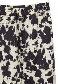 Schwarz-weiße gemusterte Jogginghosen mit elastischem Bund, Kordelzug und weichem Stoff mit glatter Textur.