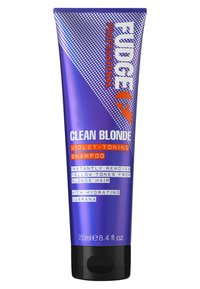 Champú tonificante violeta en un tubo morado con texto blanco y naranja. Tamaño 250 ml. Presenta una tapa negra y elementos de diseño geométrico.