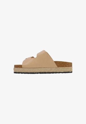 Sandalo beige aperto con plantare in sughero, due fibbie frontali, intersuola in corda intrecciata e suola esterna in gomma nera testurizzata.