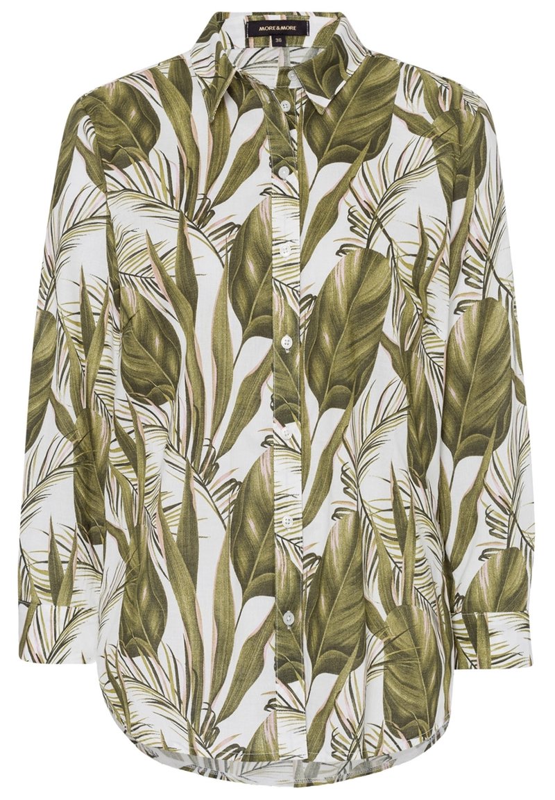 Chemise à manches longues avec un motif de feuilles vertes sur fond blanc, avec un devant à boutons et un ourlet arrondi pour un ajustement décontracté.