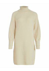Abito in maglia color crema, con coste, col alto, maniche ampie e spacco laterale per facilitare i movimenti. Texture morbida, che arriva a metà coscia.