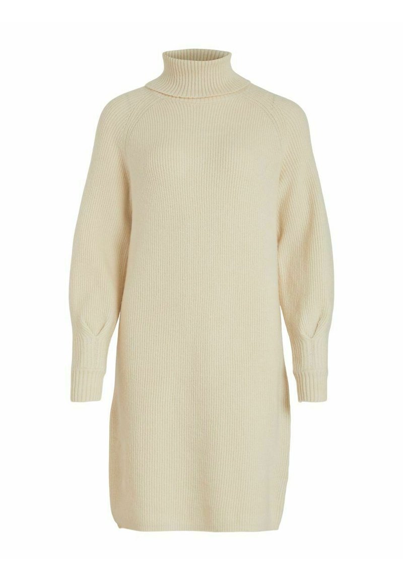 Robe pull crème à côtes avec un col haut, des manches amples et des fentes sur les côtés pour plus de facilité. Texture douce, atteignant la mi-cuisse.